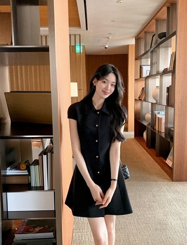 Elegant black dress with gold buttons