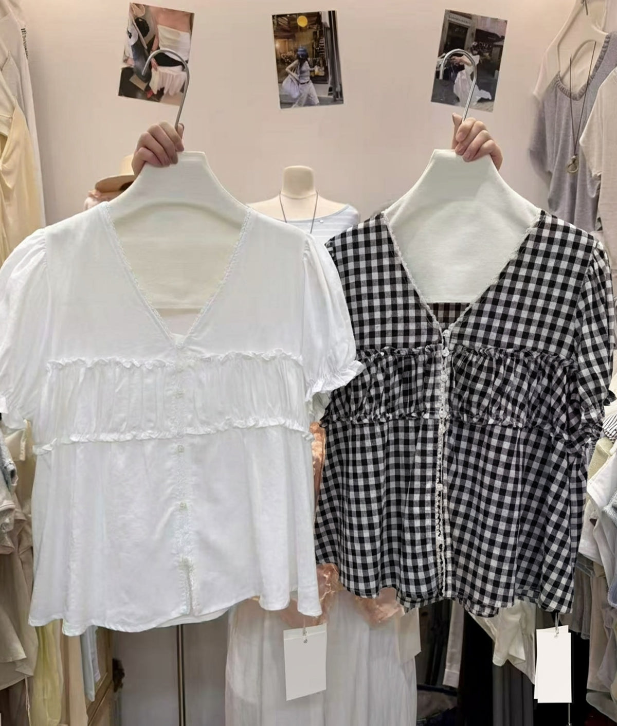 Two short-sleeved V-neck blouses with ruffle details, one in solid white and one in black and white gingham