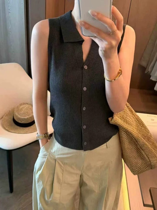 Model wearing premium grey sleeveless ribbed knit polo top