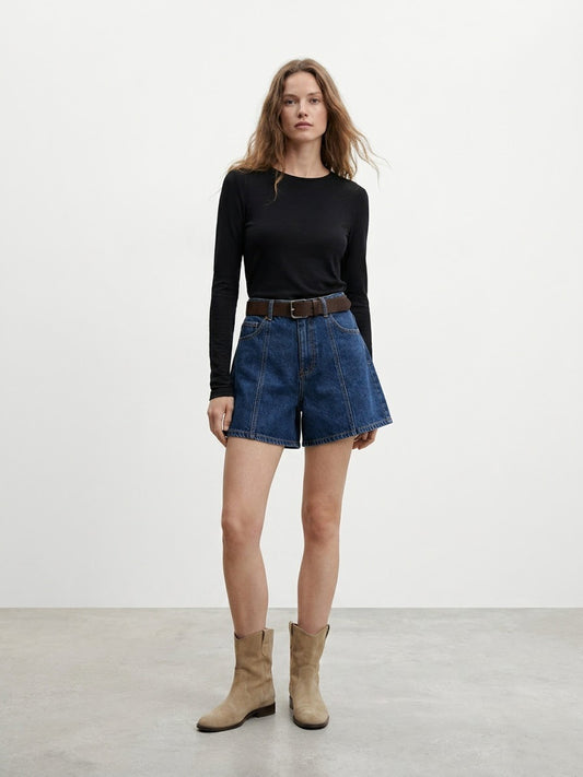 Back view of model wearing early autumn high-waisted denim shorts