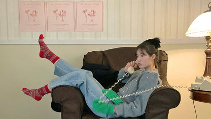 パール編みケーブル柄セーター