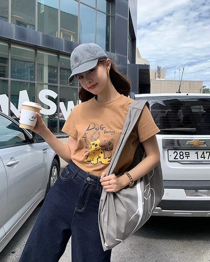 丸首の可愛い犬のTシャツ