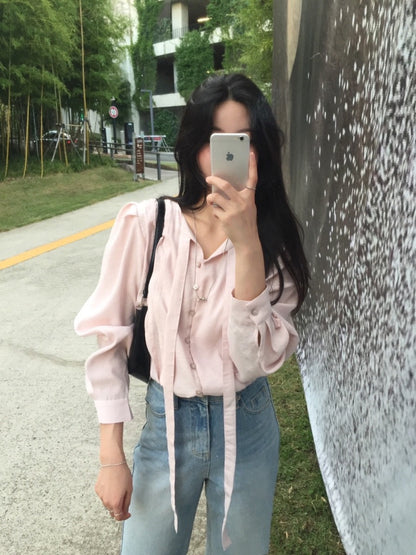 French-style pleated blouse with small buttons