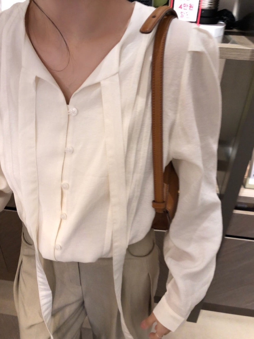 French-style pleated blouse with small buttons