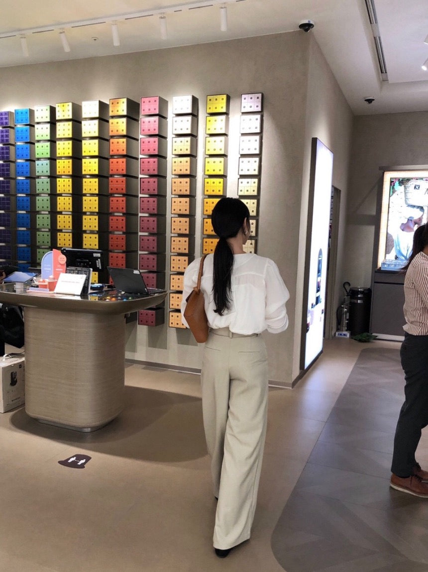 French-style pleated blouse with small buttons