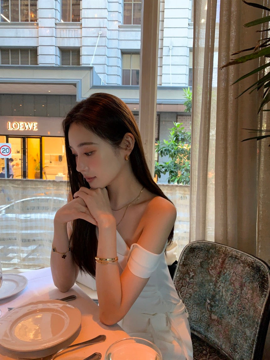 French-style asymmetrical off-shoulder top