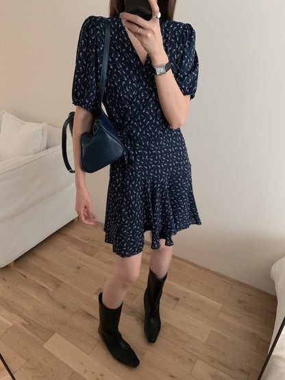 A one-piece tie-front floral dress