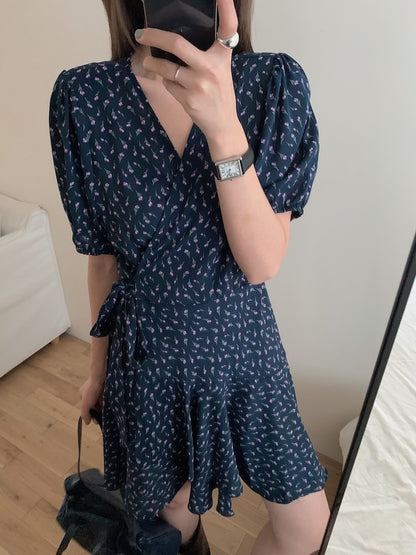 A one-piece tie-front floral dress