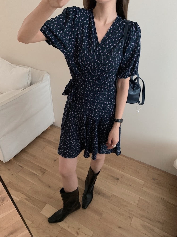 A one-piece tie-front floral dress