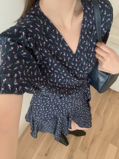 A one-piece tie-front floral dress