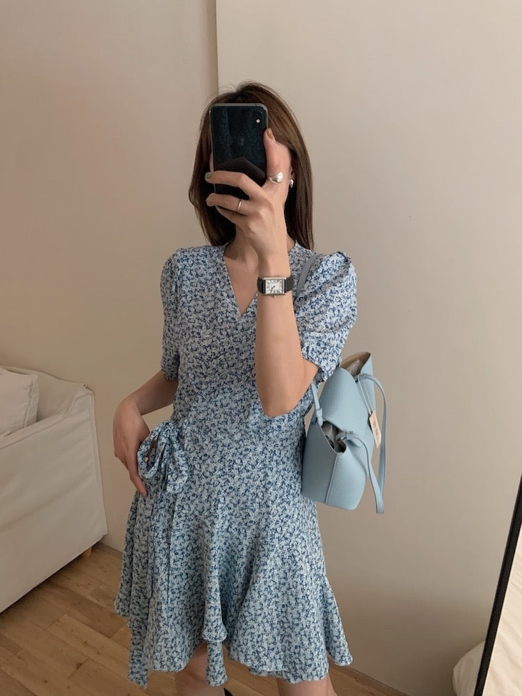 A one-piece tie-front floral dress