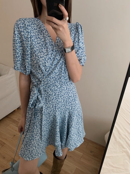 A one-piece tie-front floral dress