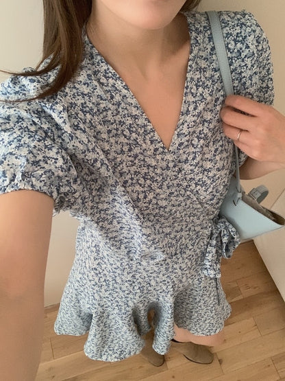 A one-piece tie-front floral dress