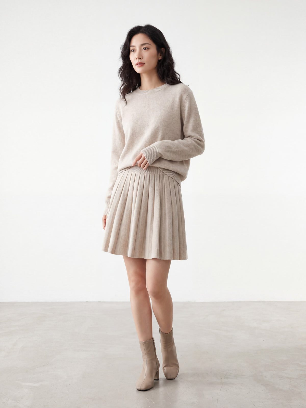 Multiple colors of Korean simple soft knit pleated skirts on a rack