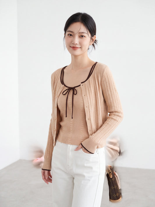 Woman wearing orange-pink ribbed knit camisole and cardigan set