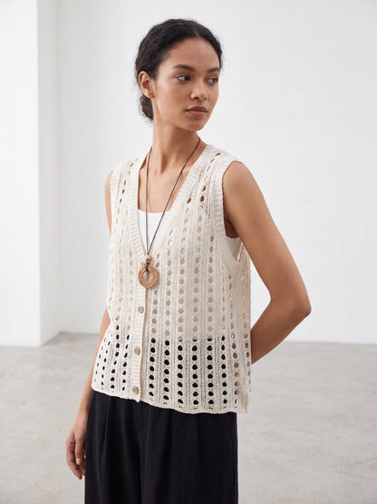 Six knitted hollow-out vests in bright orange, army green, khaki, coffee, caramel orange, and apricot on hangers