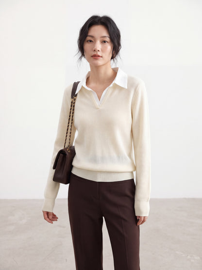 Mannequin wearing an apricot long-sleeve knit top with a white polo collar.