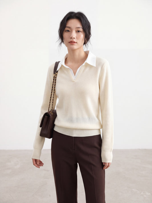 Mannequin wearing an apricot long-sleeve knit top with a white polo collar.