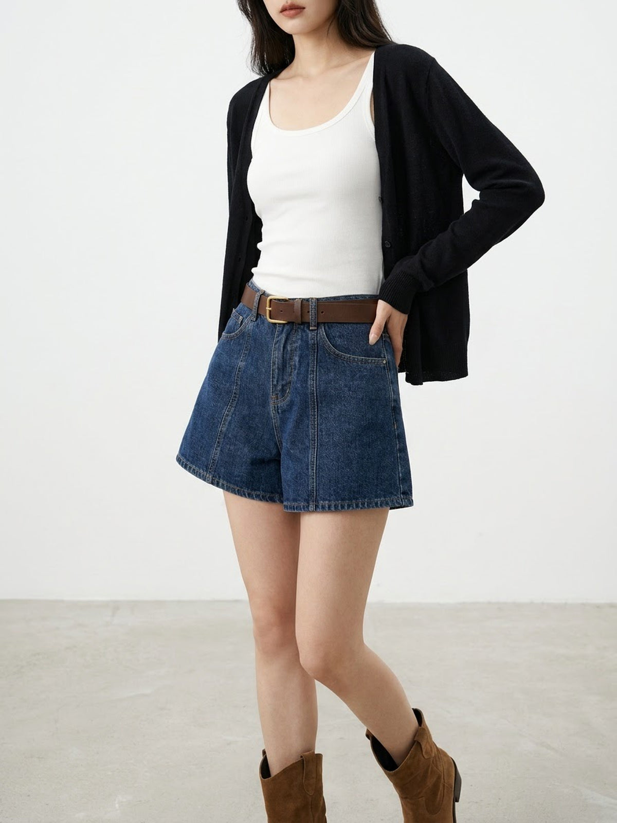 Front view of model wearing early autumn high-waisted denim shorts