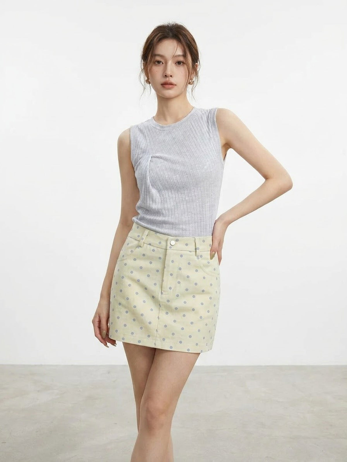 Close up of apricot polka dot A-line mini skirt