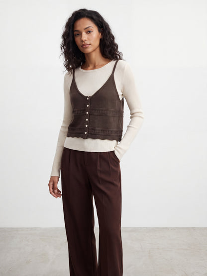 Mannequins and hangers displaying the knit top and vest two-piece sets in various colors