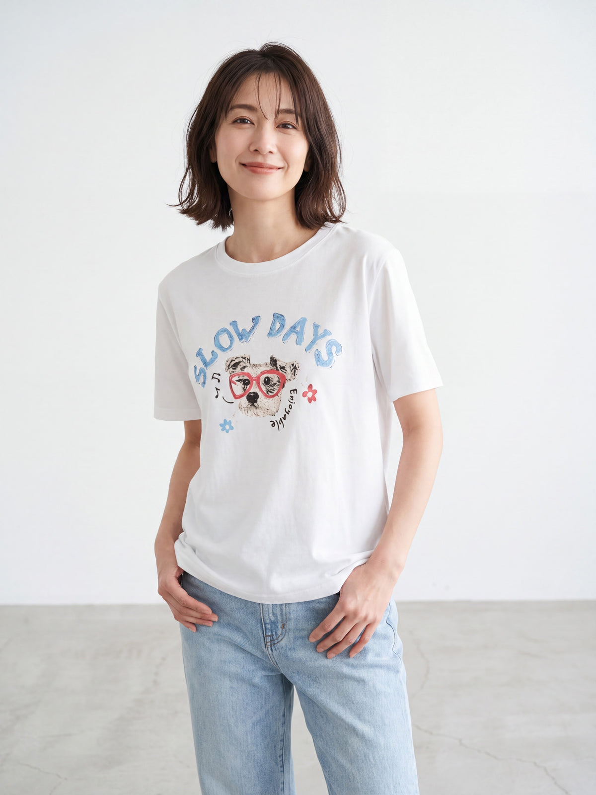 White dog graffiti t-shirt hanging on a hanger
