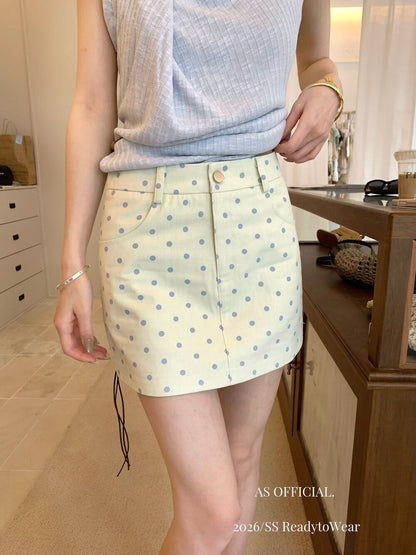 Model wearing apricot polka dot A-line mini skirt