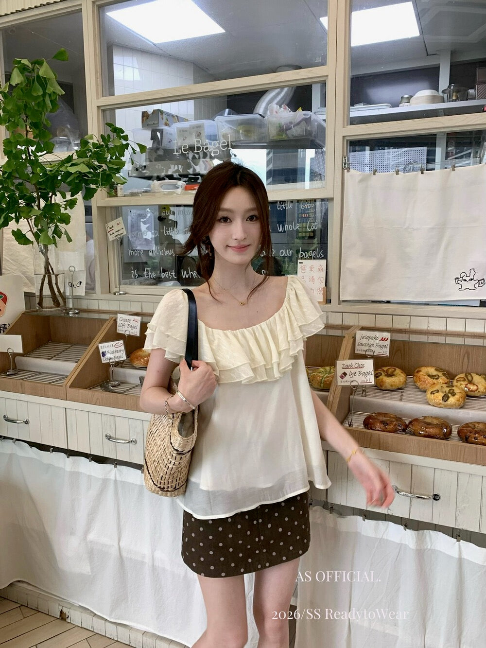 Model wearing brown polka dot A-line mini skirt