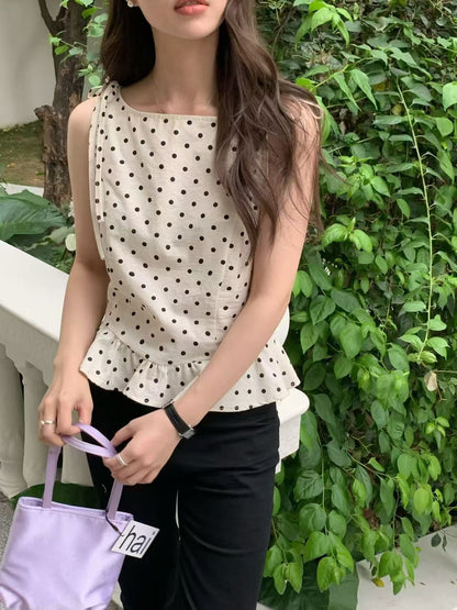 Close-up of polka dot tie-strap ruffled sleeveless top