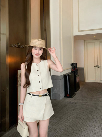 Full body shot of woman in beige two-piece set