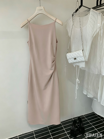 Light pink sleeveless dress hanging on a hanger