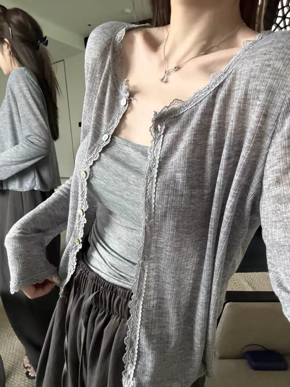 Model wearing grey lace spliced soft sunscreen cardigan close up