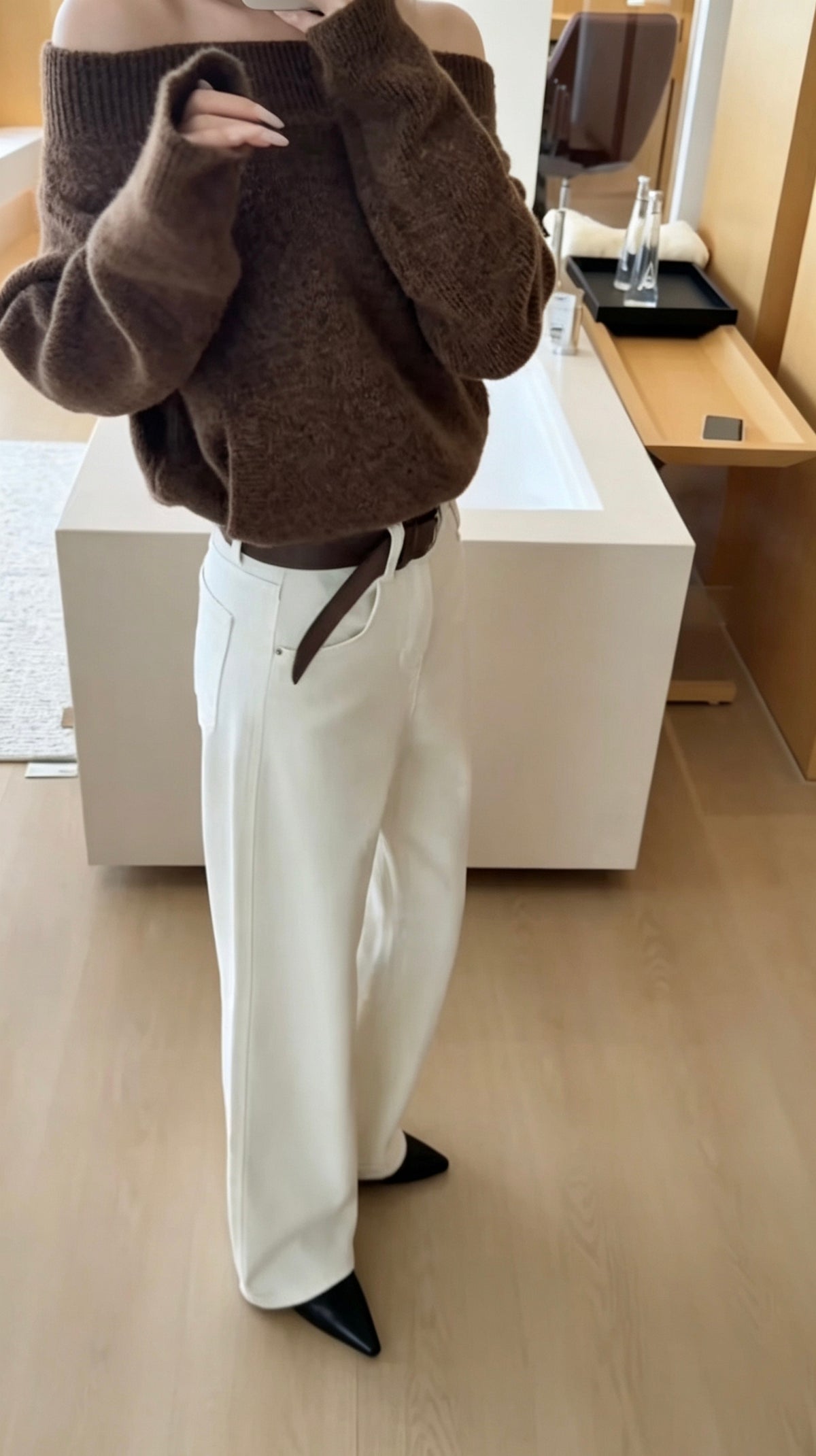 Model wearing white straight jeans