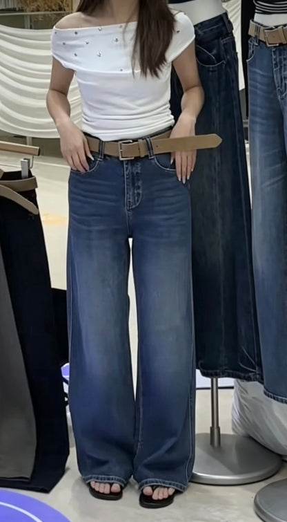 Model wearing dark blue straight jeans