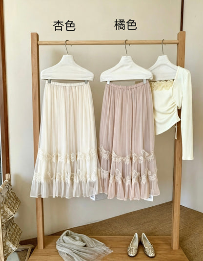 Apricot and peach lace trim tulle skirts hanging on rack