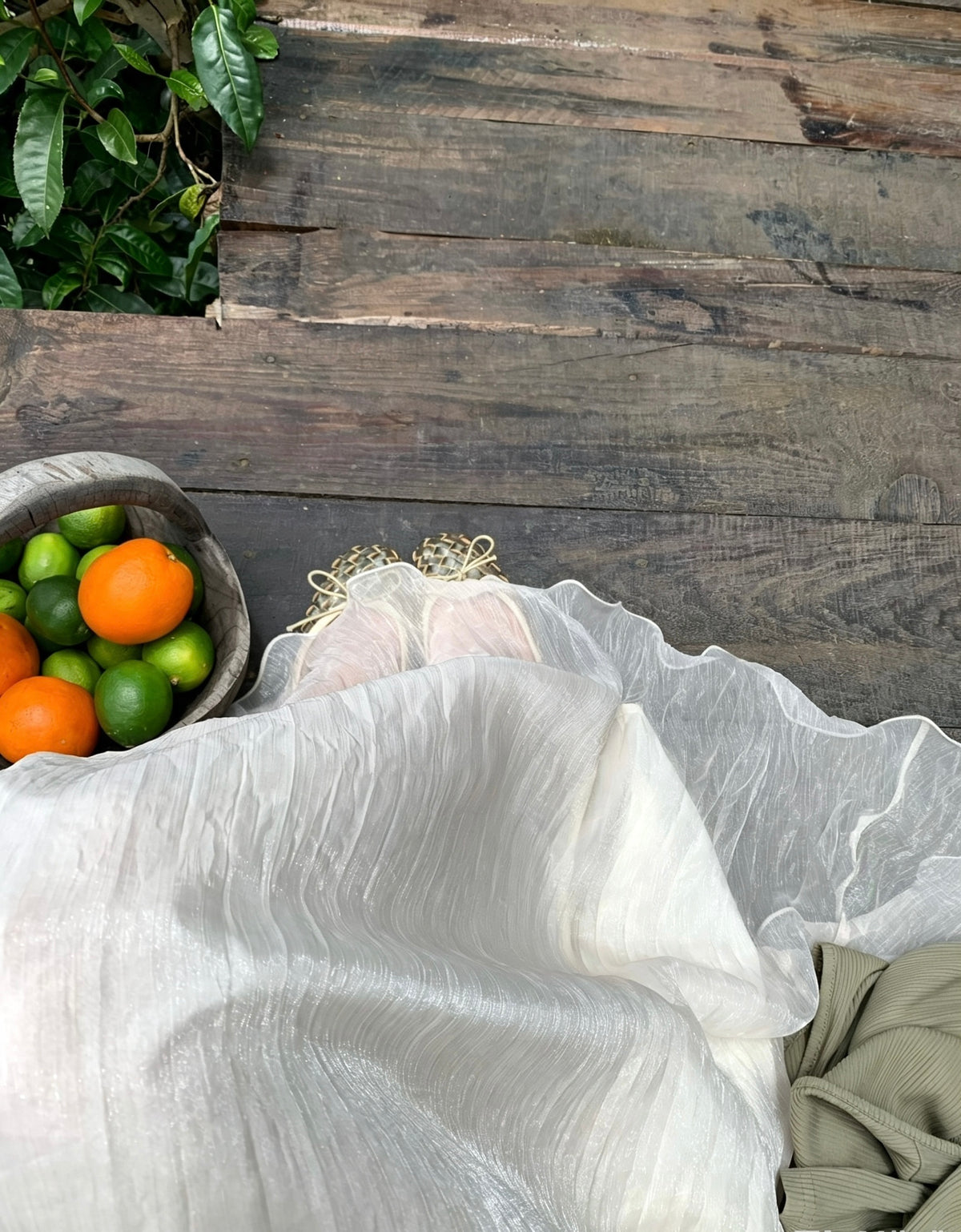 Top-down view of the apricot mesh skirt and woven shoes