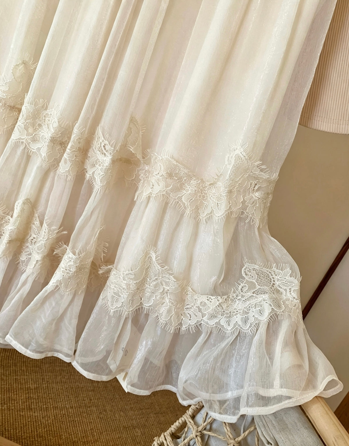 Close-up of shimmering tulle fabric with lace trim