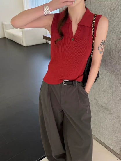Model wearing retro red ribbed sleeveless polo top