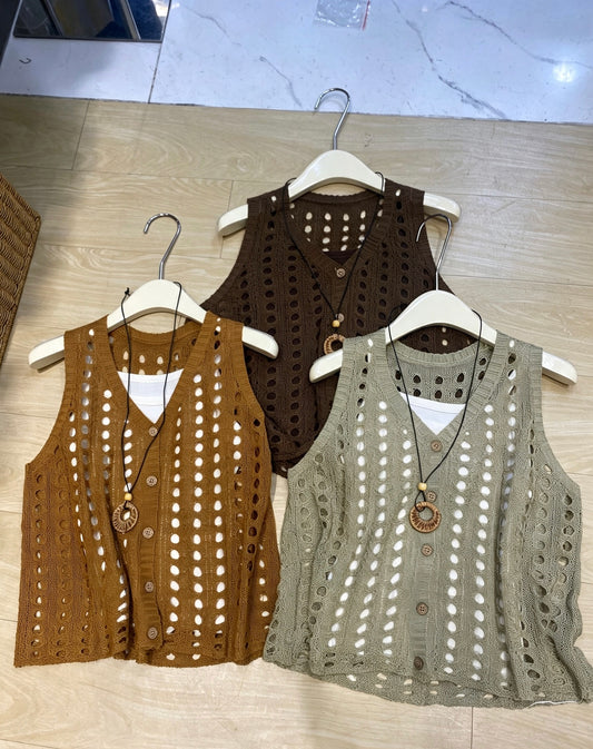 Three knitted hollow-out vests in brown, rust, and light olive displayed on hangers
