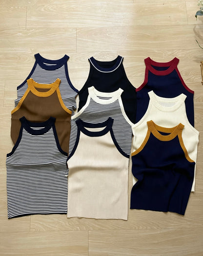 Flat lay of ribbed knit halter tops in various colors and striped patterns