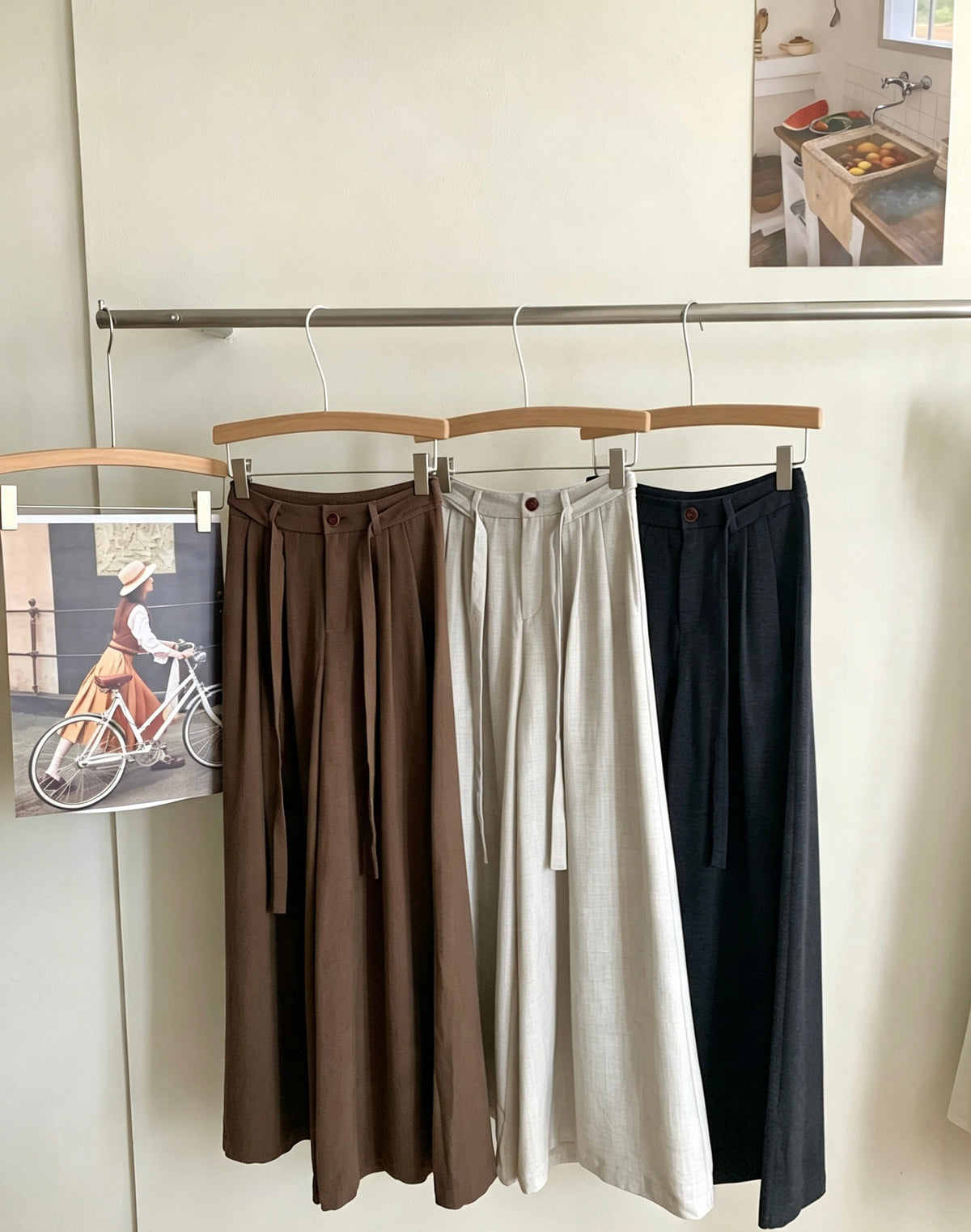 Slouchy wide-leg trousers in three colors hanging together