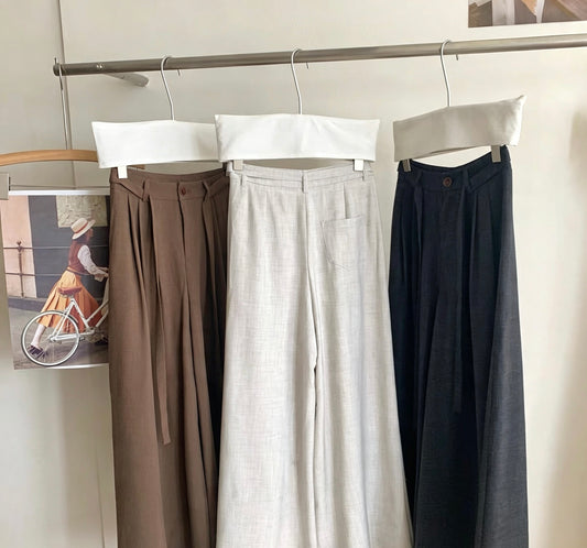 Close-up of wide-leg pants waist details with belt loops
