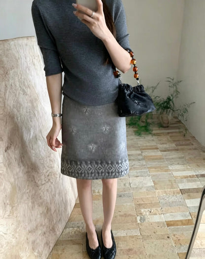 Model wearing the embroidered tie-dye vintage skirt in grey