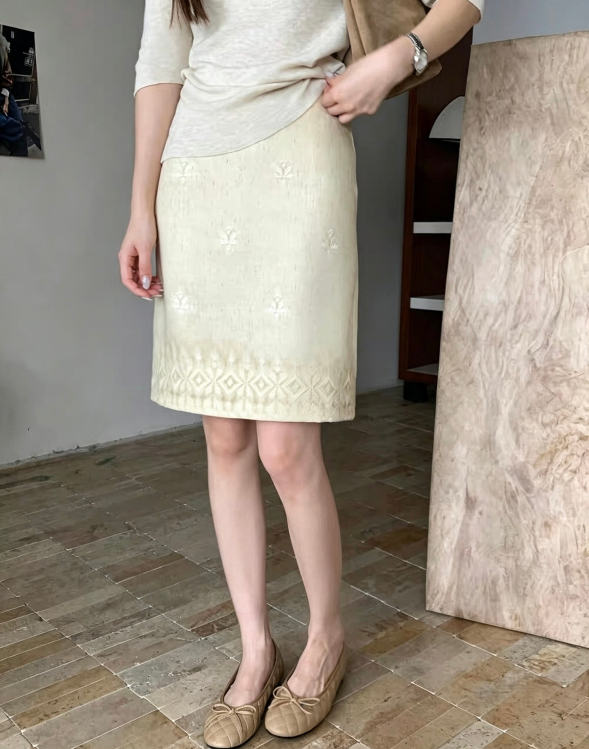 Model wearing the embroidered tie-dye vintage skirt in cream