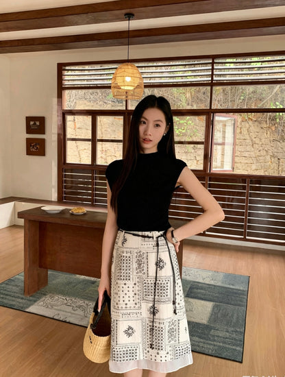 Woman wearing an apricot patterned midi skirt with a sheer hem