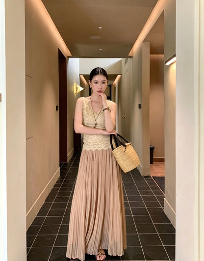 Model twirling in an apricot pleated maxi skirt