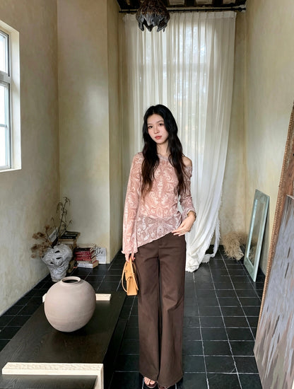 Model in sheer paisley top and brown pants