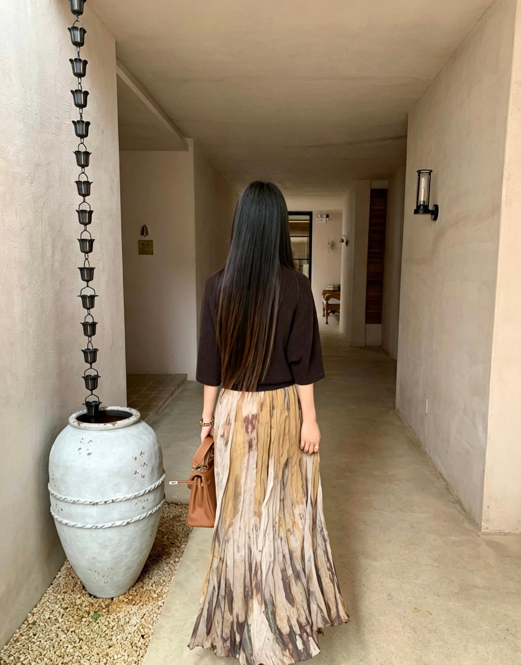 Back view of the khaki tie-dye print pleated flowy skirt