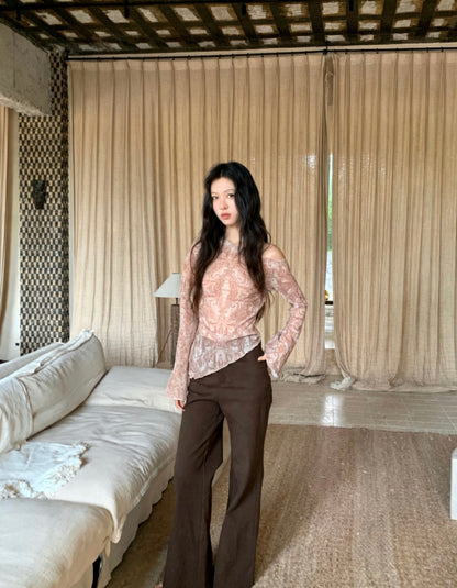 Model posing in irregular hem retro print top