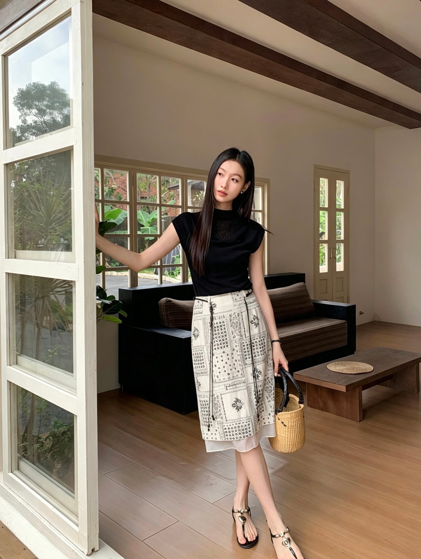 Model posing indoors wearing a French high-end retro ink print midi skirt